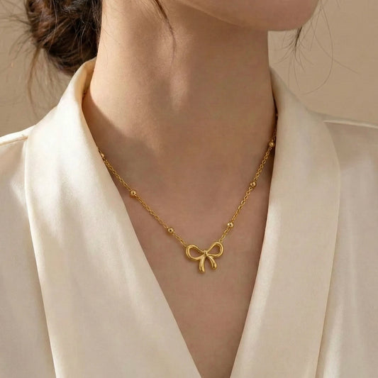 18Kt Gold Plated Bow Pendant & Nail Bracelet Set