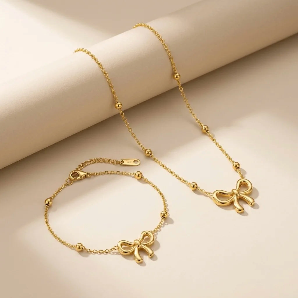 18Kt Gold Plated Bow Pendant Necklace & Bracelet Set