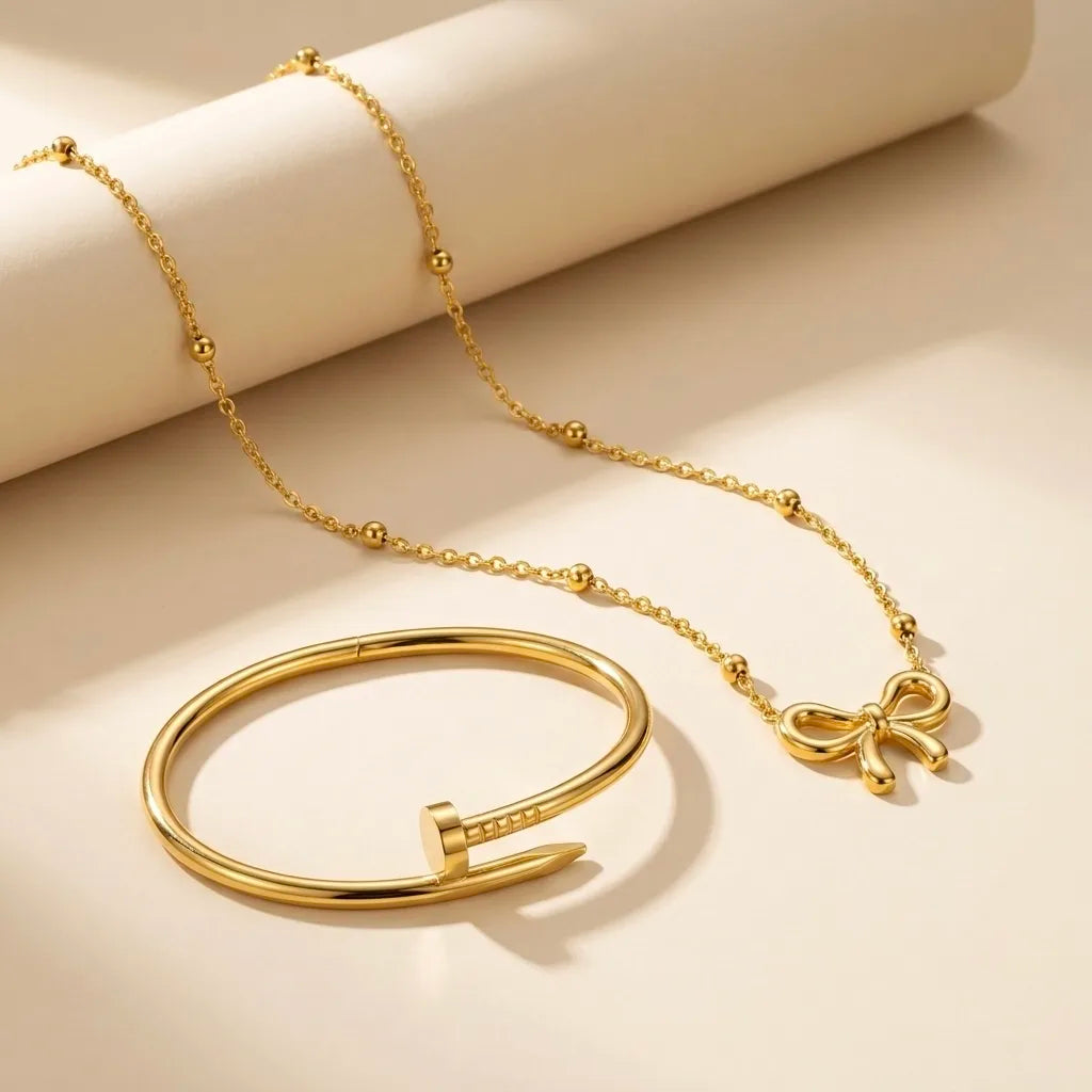 18Kt Gold Plated Bow Pendant & Nail Bracelet Set